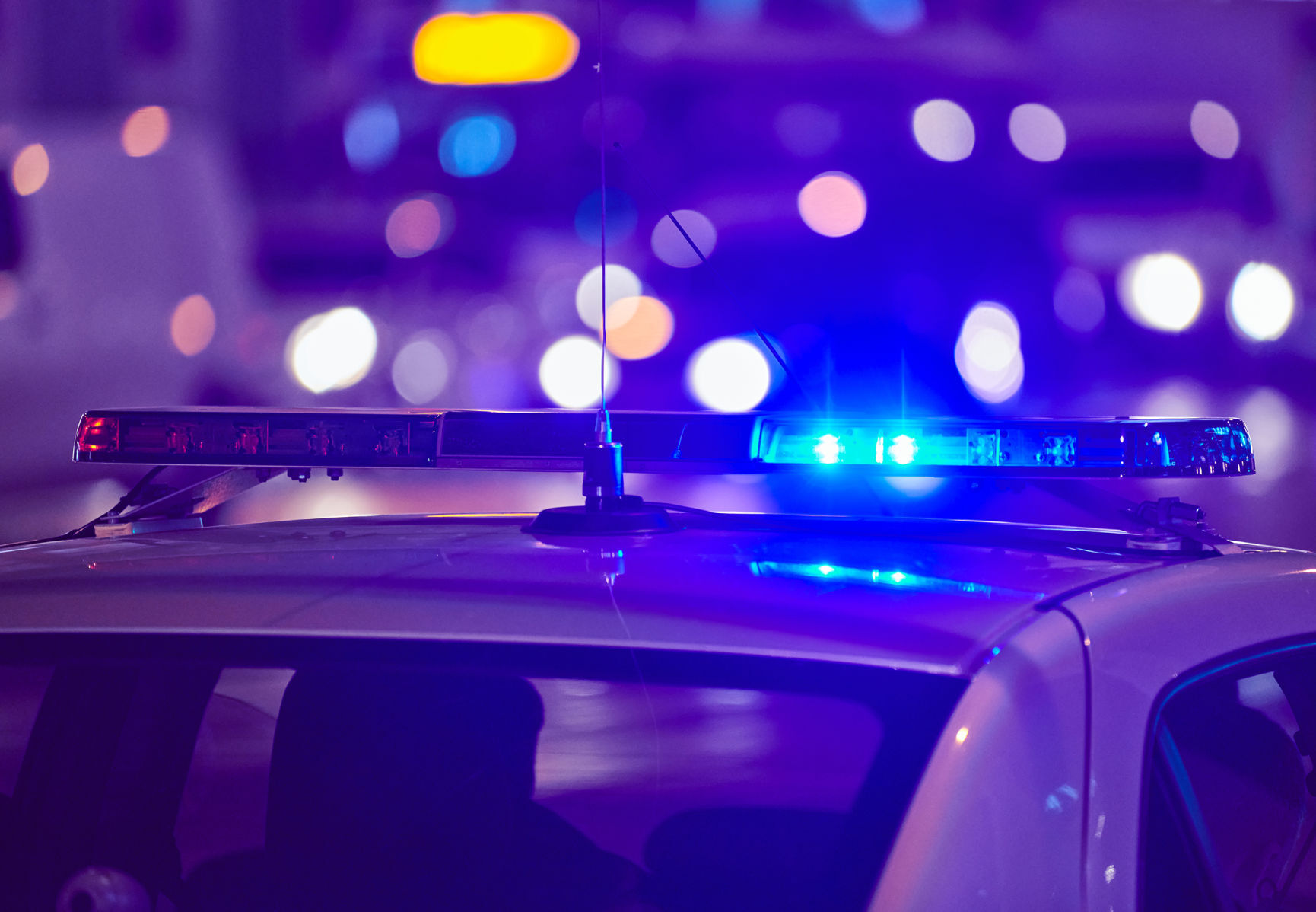 Police car lights at night city street